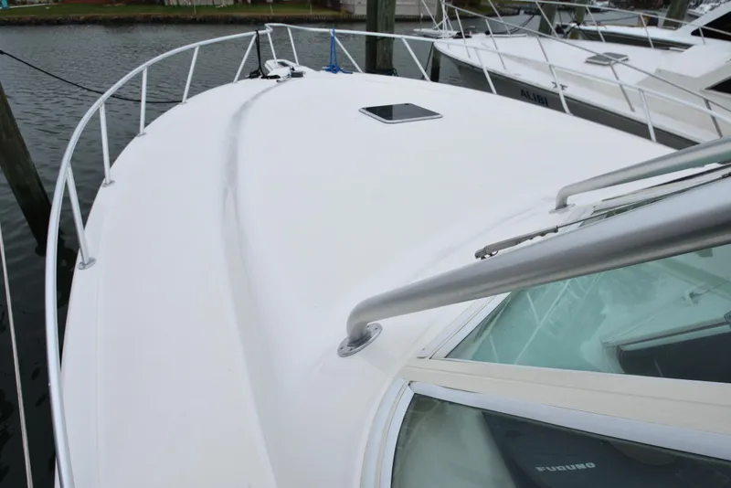 Slide: The Image of 2006 Albemarle 41 Express boat deck and railing at marina. - 43