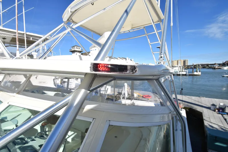 Slide: The Image of 2006 Albemarle 41 Express boat docked at marina, close-up of the bridge and navigation light. - 46