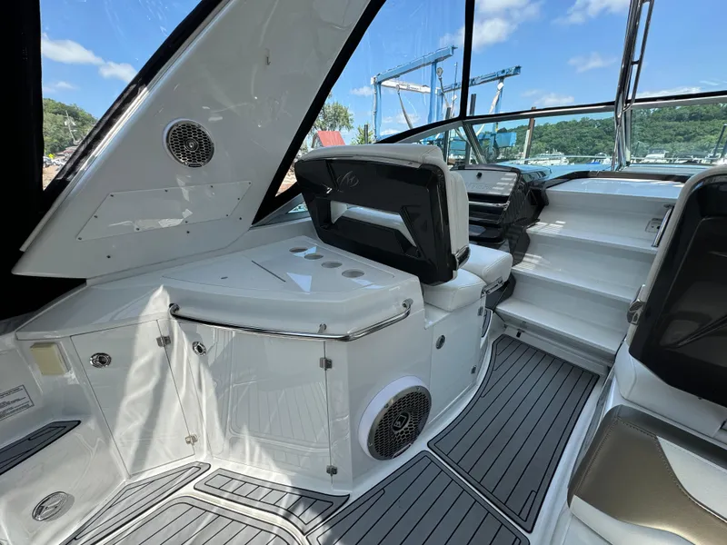 Slide: The Image of 2019 Monterey 335 SY boat interior with seating and modern dashboard. - 19