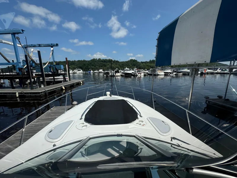Slide: The Image of 2019 Monterey 335 SY boat docked at a marina under a clear blue sky. - 25