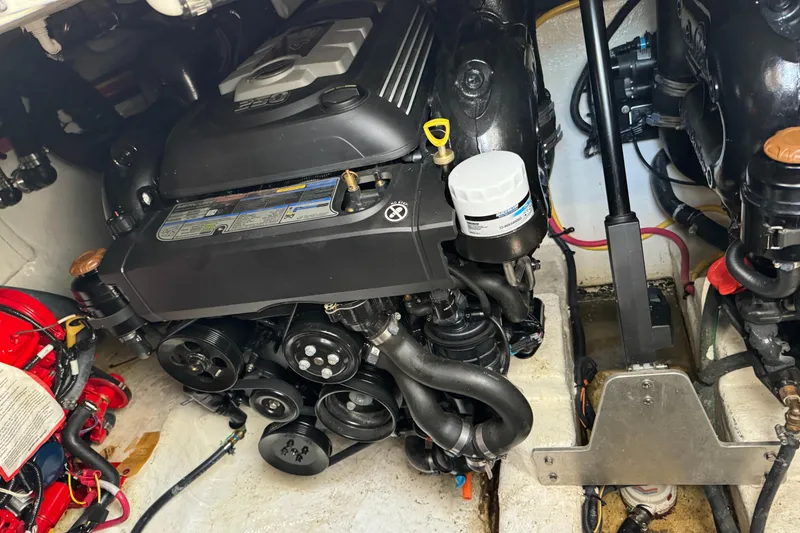 Slide: The Image of Engine compartment of a 2019 Monterey 335 SY boat, showcasing mechanical components. - 31