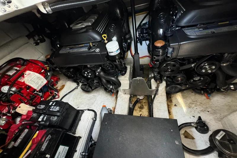 Slide: The Image of Engine room of a 2019 Monterey 335 SY boat, showcasing dual engines and battery setup. - 32