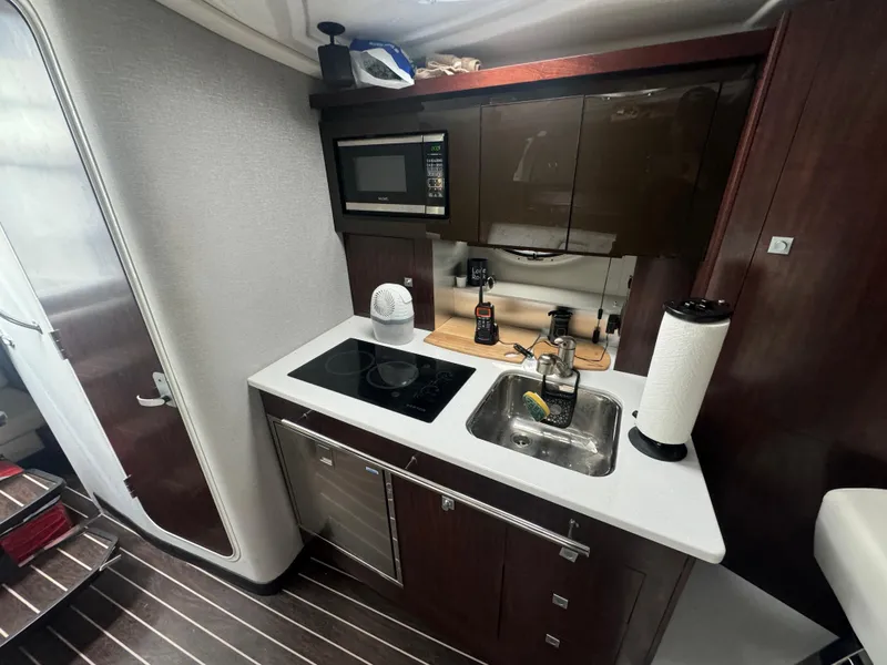 Slide: The Image of Compact kitchen in 2019 Monterey 335 SY yacht with modern appliances and sleek design. - 37