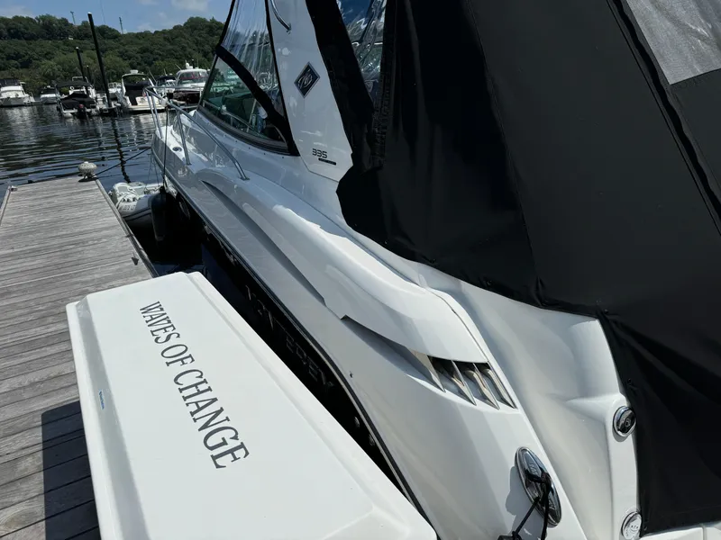 Slide: The Image of 2019 Monterey 335 SY boat docked, featuring "Waves of Change" text on the stern. - 4