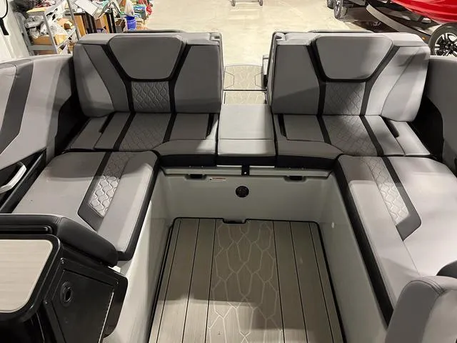 Slide: The Image of 2024 Yamaha Boats 255XE interior with sleek gray seating and modern design. - 10