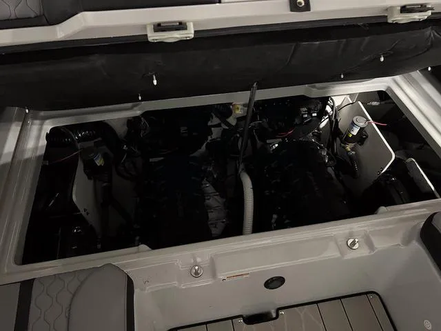 Slide: The Image of 2024 Yamaha Boats 255XE engine compartment, showcasing dual engines and modern design. - 11