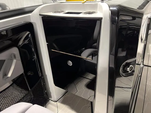 Slide: The Image of 2024 Yamaha Boats 255XE interior with sleek black and white design. - 15