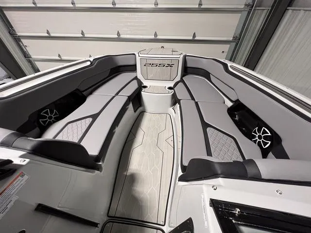 Slide: The Image of 2024 Yamaha Boats 255XE interior with sleek gray seating and modern design. - 25