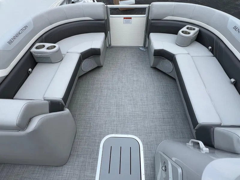 Slide: The Image of 2025 Bennington 21 SXSB pontoon boat interior with gray seating and cup holders. - 10