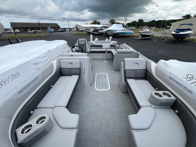 Slide: The Image of 2025 Bennington 21 SXSB pontoon boat with spacious seating and modern design. - 11