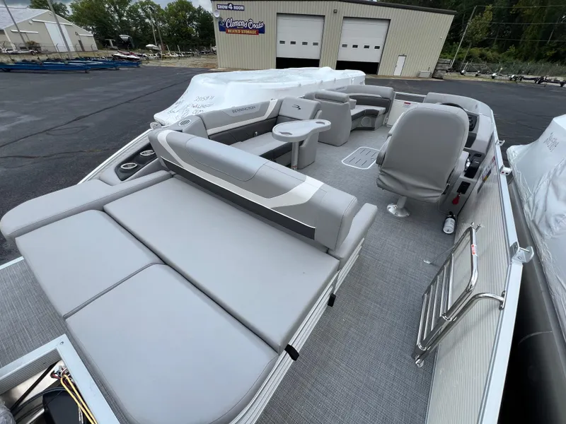 Slide: The Image of 2025 Bennington 21 SXSB pontoon boat with spacious seating and modern design. - 9