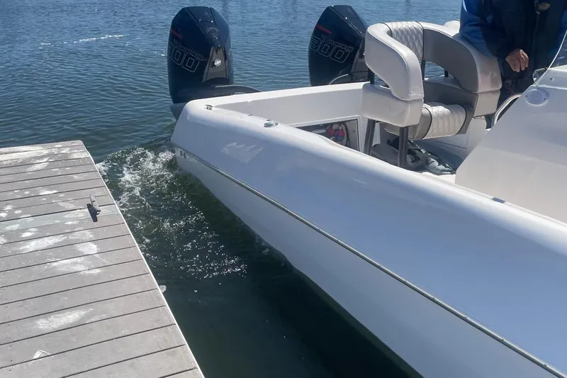 Slide: The Image of 2025 Hustler 25 C3 Speedfish boat docked with twin outboard engines. - 9