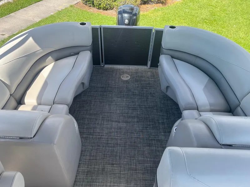 Slide: The Image of 2022 Cypress Cay Seabreeze 232 pontoon boat interior with helm and seating. - 6