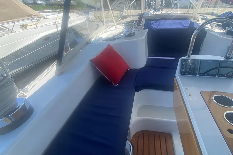 Slide: The Image of Catalina 470 sailboat cockpit with blue cushions and red pillow, 2007 model. - 13