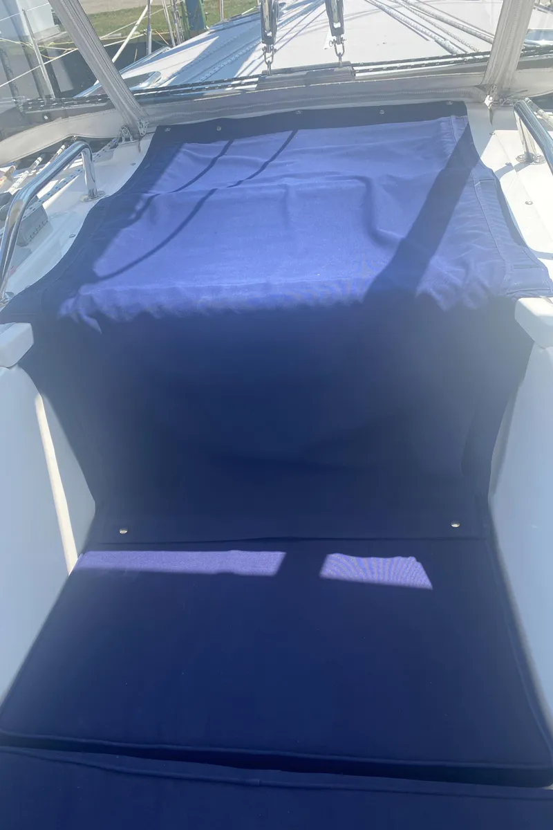 Slide: The Image of 2007 Catalina 470 sailboat cockpit with blue cover. - 14