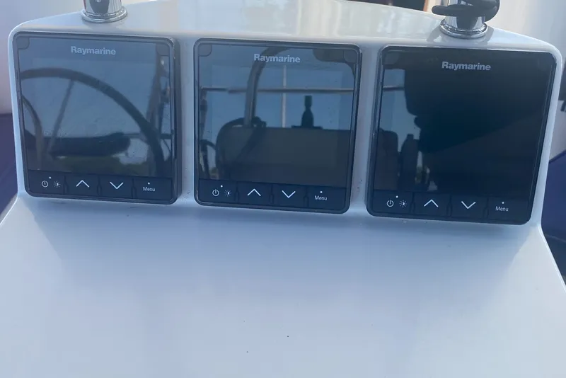 Slide: The Image of Raymarine navigation displays on a 2007 Catalina 470 yacht dashboard. - 20