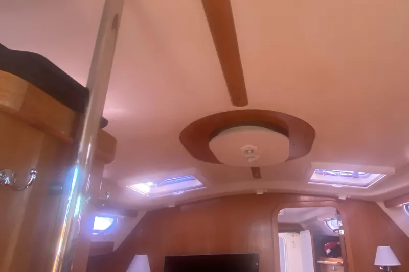 Slide: The Image of Interior of 2007 Catalina 470 sailboat with wooden finishes and skylights. - 27