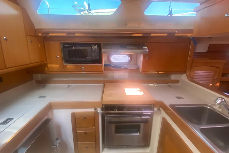 Slide: The Image of Catalina 470 yacht kitchen interior with modern appliances, 2007 model. - 30