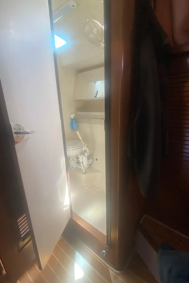Slide: The Image of Catalina 470 yacht bathroom interior, 2007 model, featuring wooden accents and modern fixtures. - 45