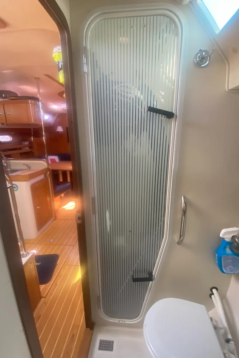 Slide: The Image of Interior of 2007 Catalina 470 yacht bathroom with shower and toilet. - 48