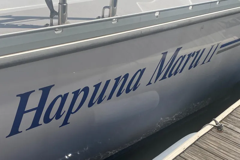 Slide: The Image of Catalina 470 sailboat, 2007 model, named "Hapuna Maru II" docked at a marina. - 6