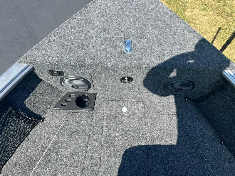 Slide: The Image of 2025 Lund 1875 Impact XS Sport boat interior with speakers and storage compartments. - 15