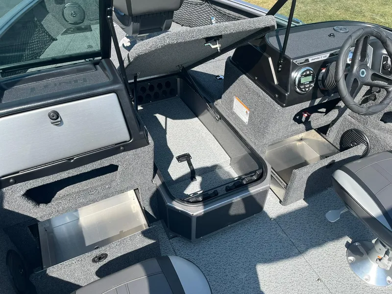 Slide: The Image of Interior of 2025 Lund 1875 Impact XS Sport boat with open storage compartments. - 20