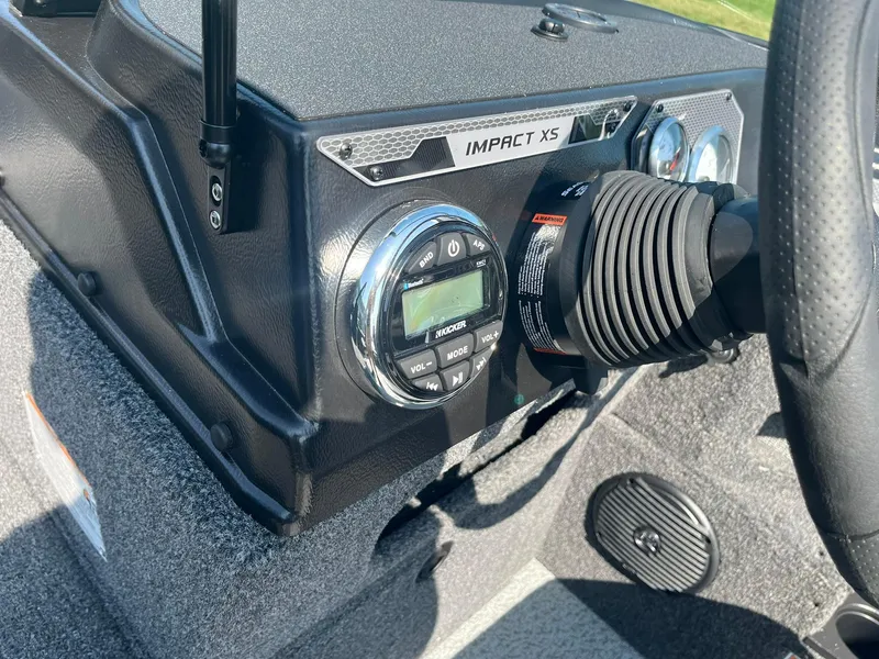 Slide: The Image of 2025 Lund 1875 Impact XS Sport dashboard with controls and steering wheel. - 26