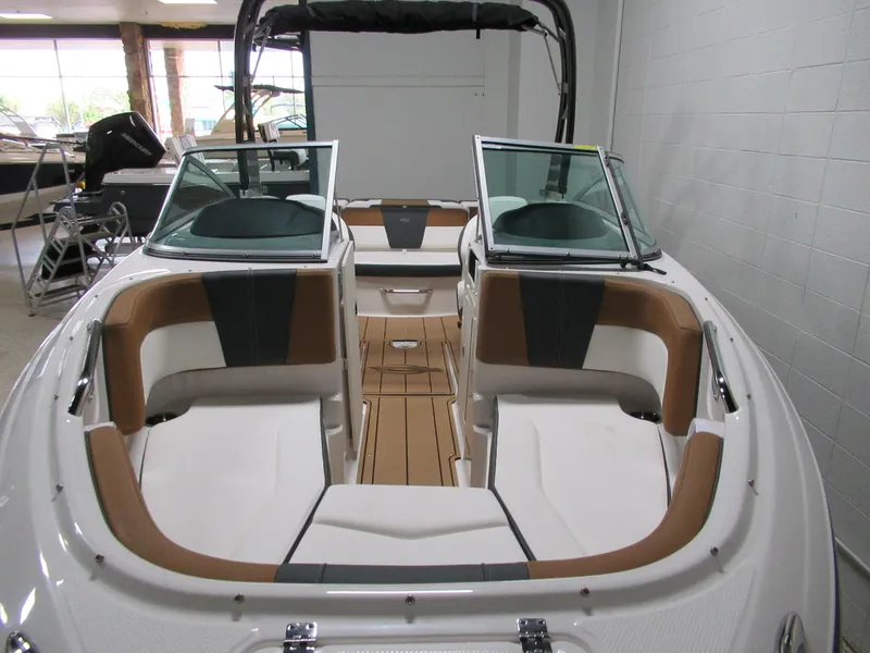 Slide: The Image of 2024 Chaparral 21 SSi boat interior with tan and white seating. - 4