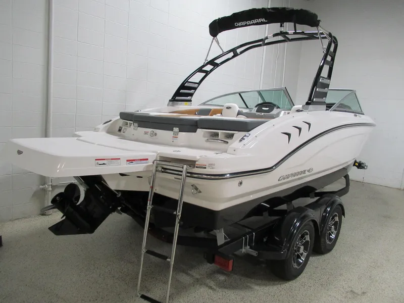 Slide: The Image of 2024 Chaparral 21 SSi boat on trailer in showroom. - 6