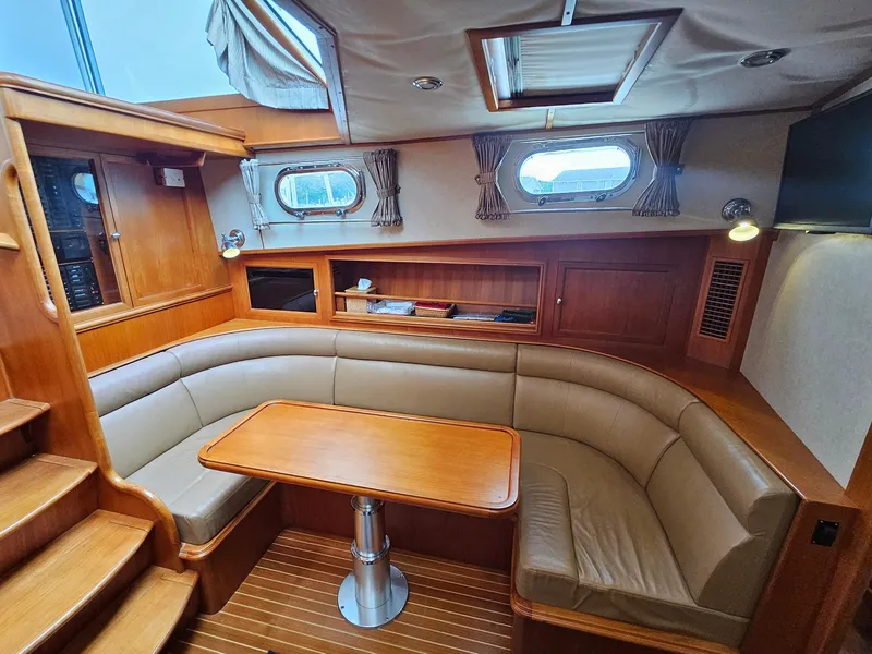 Slide: The Image of Luxurious 2007 Grand Banks 39 Eastbay SX yacht interior with elegant seating and wooden finishes. - 19