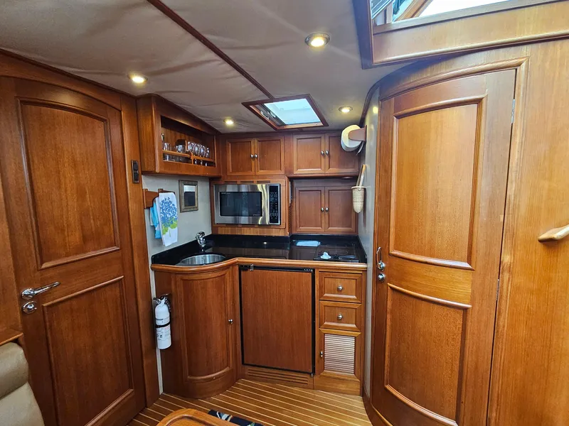 Slide: The Image of Luxurious 2007 Grand Banks 39 Eastbay SX yacht interior with wood cabinetry and modern amenities. - 20