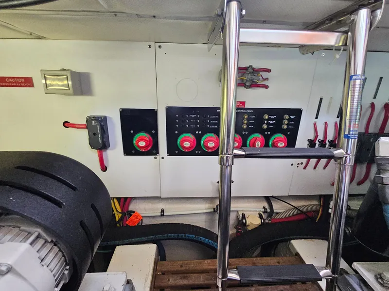 Slide: The Image of Engine room of 2007 Grand Banks 39 Eastbay SX with control panels and equipment. - 31