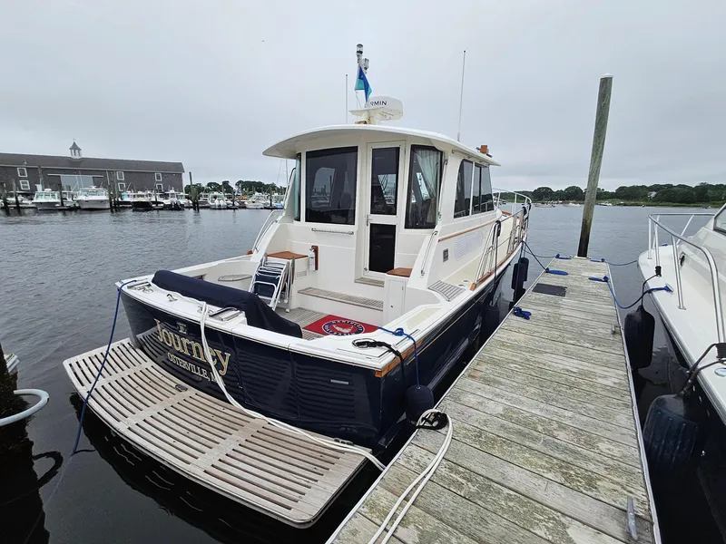 Slide: The Image of 2007 Grand Banks 39 Eastbay SX docked at marina, rear view. - 6