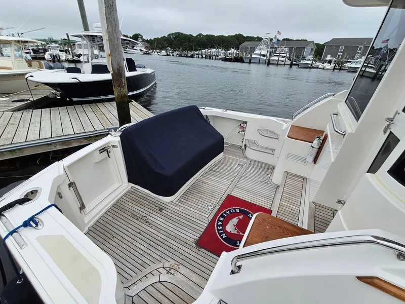 Slide: The Image of 2007 Grand Banks 39 Eastbay SX yacht docked at marina, featuring spacious deck area. - 7