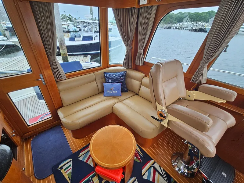 Slide: The Image of Luxurious 2007 Grand Banks 39 Eastbay SX yacht interior with leather seating and scenic marina view. - 9