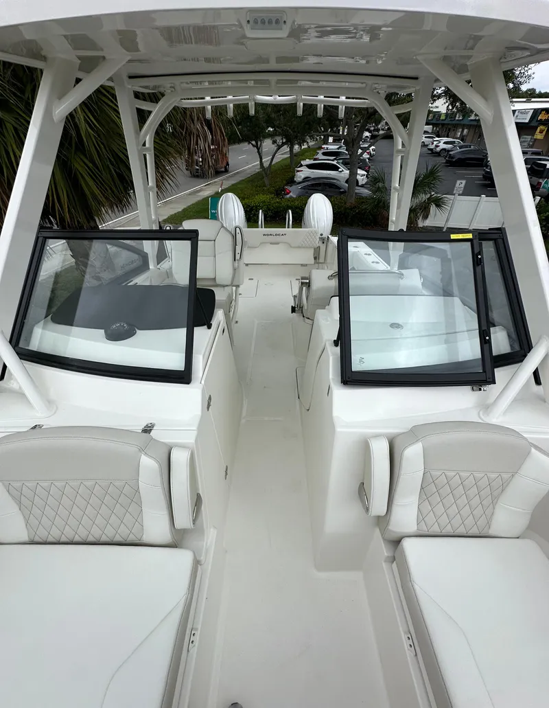 Slide: The Image of 2025 World Cat 260 DC-X boat interior with seating and open deck design. - 10