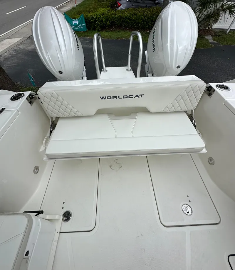 Slide: The Image of 2025 World Cat 260 DC-X boat with dual engines and spacious deck. - 12