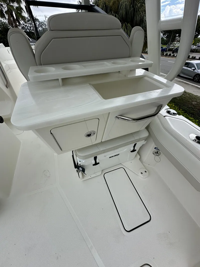 Slide: The Image of 2025 World Cat 260 DC-X boat interior with seating and storage compartments. - 17