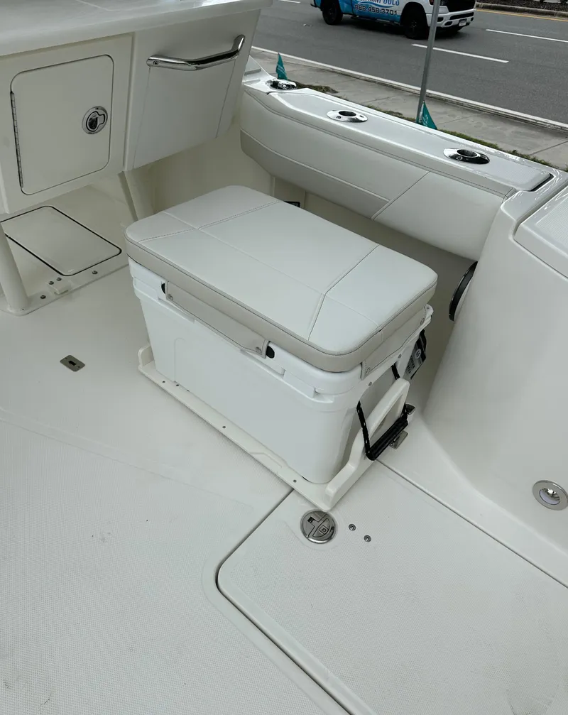 Slide: The Image of 2025 World Cat 260 DC-X boat interior with seating and storage. - 18