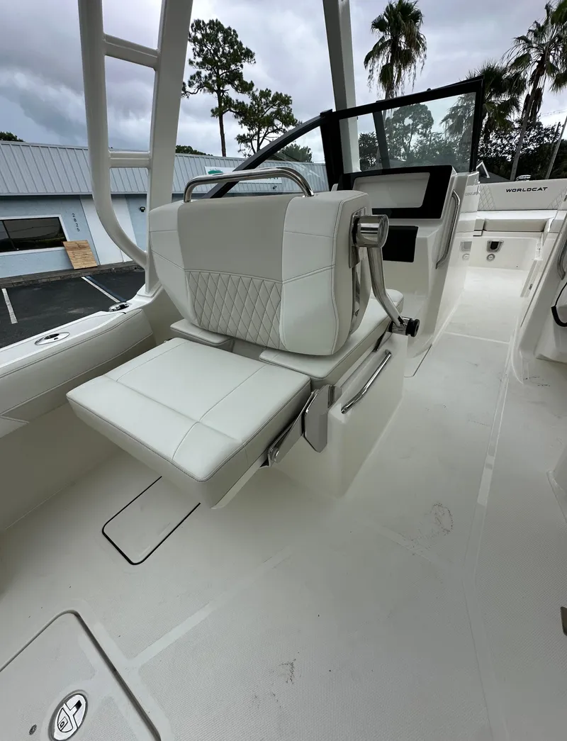 Slide: The Image of 2025 World Cat 260 DC-X boat interior with white seating and modern design. - 5