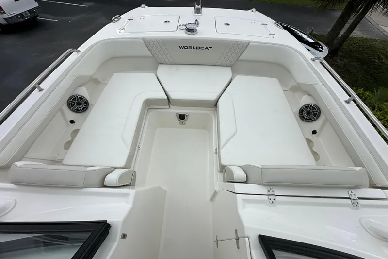 Slide: The Image of 2025 World Cat 260 DC-X boat interior with white seating and speakers. - 9