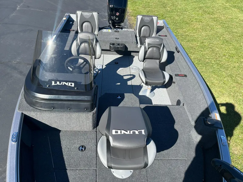 Slide: The Image of 2025 Lund 1775 Impact XS SS boat interior with seating and steering console. - 10