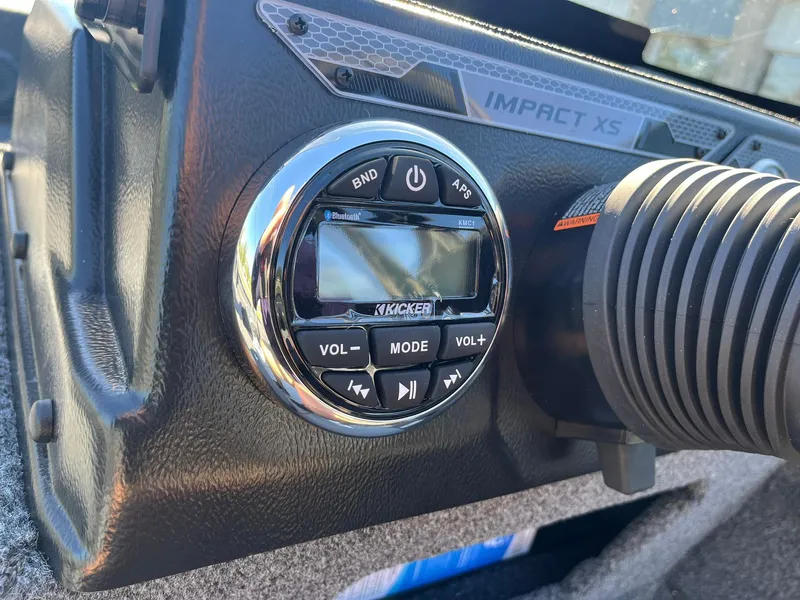 Slide: The Image of 2025 Lund 1775 Impact XS SS boat dashboard with Kicker audio system. - 19