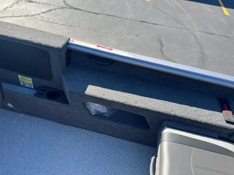 Slide: The Image of 2025 Lund 1775 Impact XS SS boat interior with seating and storage compartments. - 22