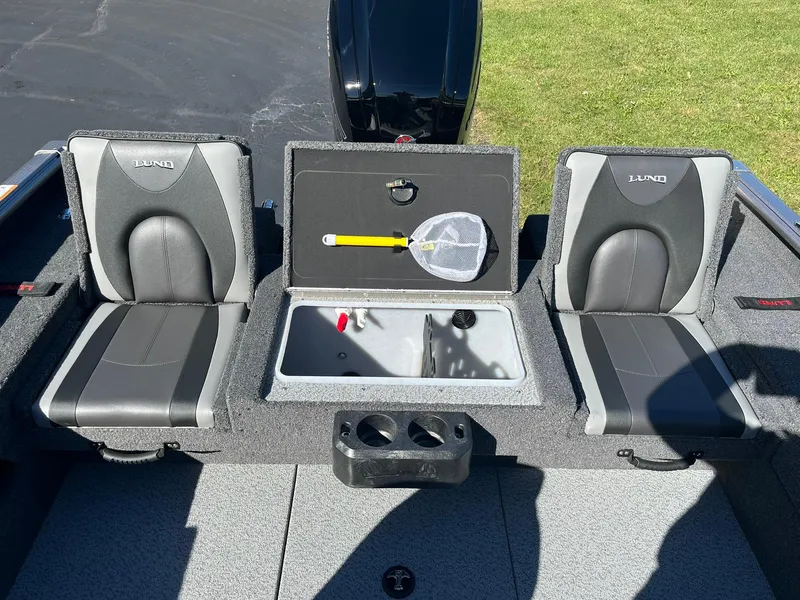 Slide: The Image of 2025 Lund 1775 Impact XS SS boat interior with seating and storage compartment. - 7