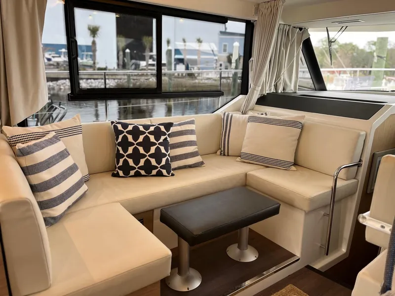 Slide: The Image of Luxurious interior of 2022 Beneteau Swift Trawler 41 Fly with stylish seating and cushions. - 13