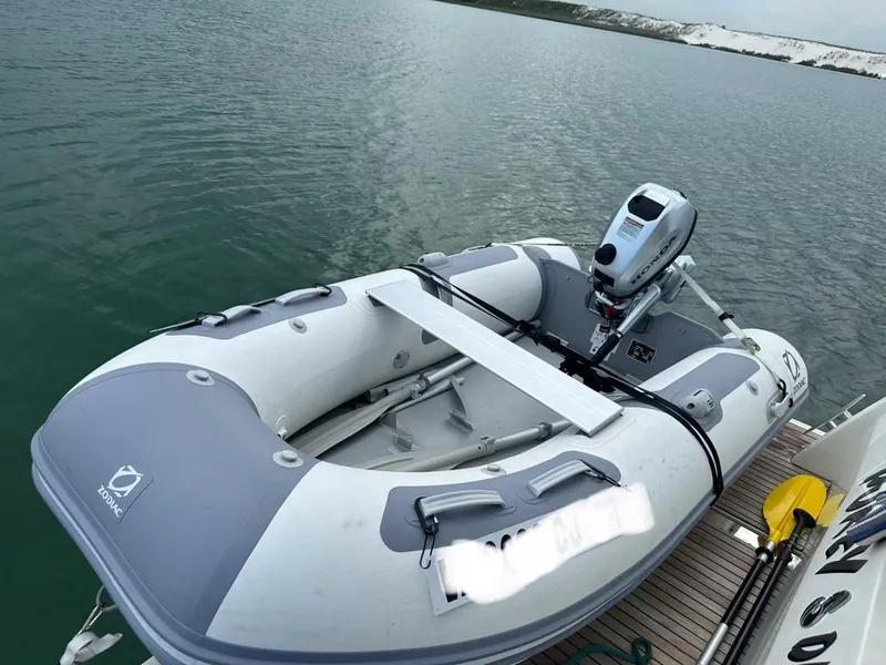 Slide: The Image of Inflatable dinghy on Beneteau Swift Trawler 41 Fly, 2022 model, docked on calm water. - 19