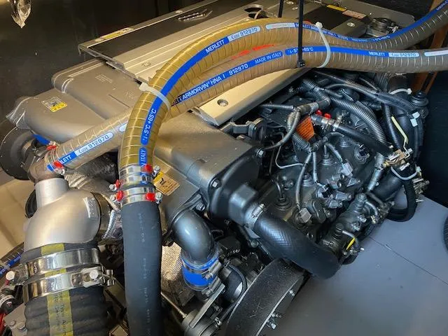 Slide: The Image of Engine of 2022 Beneteau Swift Trawler 41 Fly with visible hoses and components. - 23