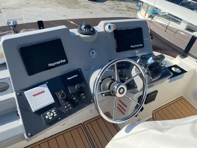 Slide: The Image of 2022 Beneteau Swift Trawler 41 Fly helm with Raymarine electronics and Yanmar controls. - 5